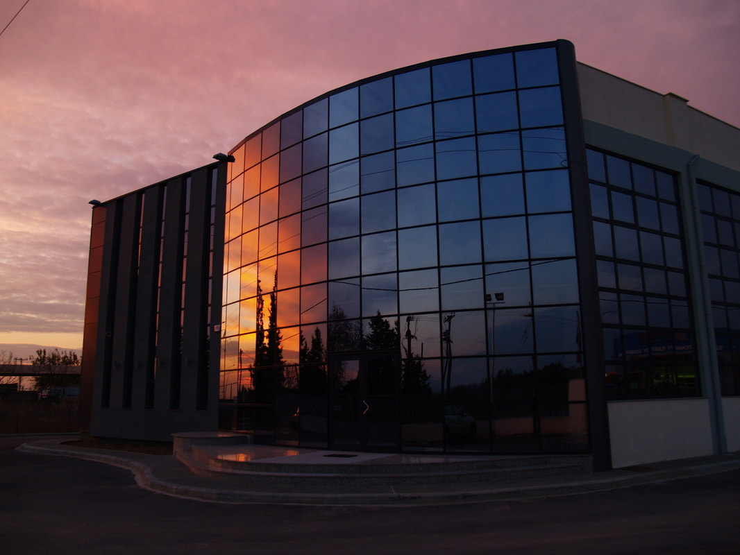Reflection of sunset in the front of Tzilvelis company in Thessaloniki